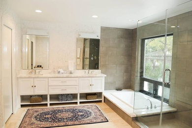 Large trendy master brown tile and porcelain tile light wood floor and beige floor bathroom photo in Houston with shaker cabinets, white cabinets, beige walls, an undermount sink, quartzite countertops and a hinged shower door