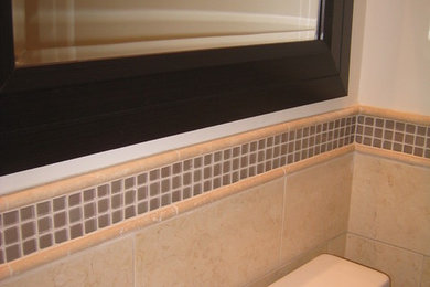 Example of a mid-sized classic 3/4 beige tile and mosaic tile ceramic tile and beige floor bathroom design in Toronto with a one-piece toilet, beige walls and a wall-mount sink