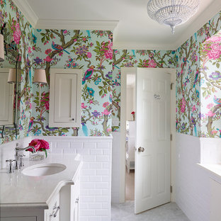 Traditional bathroom in Philadelphia with an undermount sink, recessed-panel cabinets, white cabinets, engineered quartz benchtops, white tile, subway tile, multi-coloured walls and marble floors.