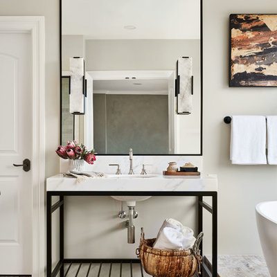 Large transitional master white tile and marble tile bathroom photo in Portland with furniture-like cabinets, black cabinets, a two-piece toilet, white walls, a console sink, marble countertops and white countertops