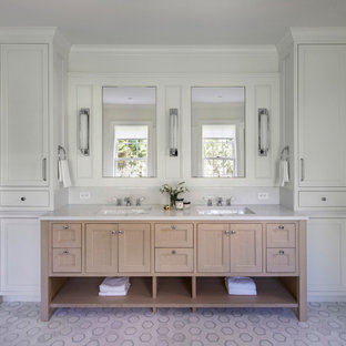 Example of a beach style mosaic tile floor, white floor and double-sink bathroom design in Providence with recessed-panel cabinets, light wood cabinets, white walls, an undermount sink, white countertops and a built-in vanity