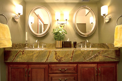 Inspiration for a contemporary bathroom remodel in Phoenix with raised-panel cabinets, medium tone wood cabinets, marble countertops and green walls