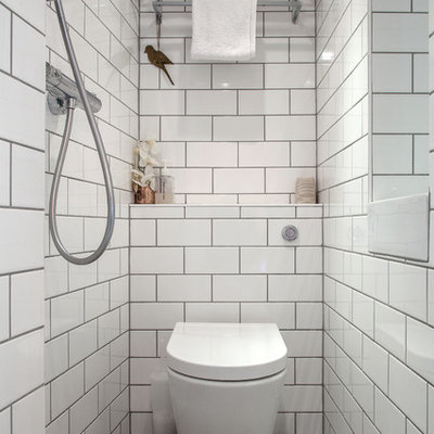 Bathroom - transitional white tile and subway tile bathroom idea in London with a one-piece toilet
