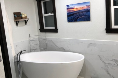 Inspiration for a large transitional master white tile and marble tile porcelain tile, white floor and double-sink bathroom remodel in Seattle with gray walls, marble countertops, a hinged shower door and white countertops