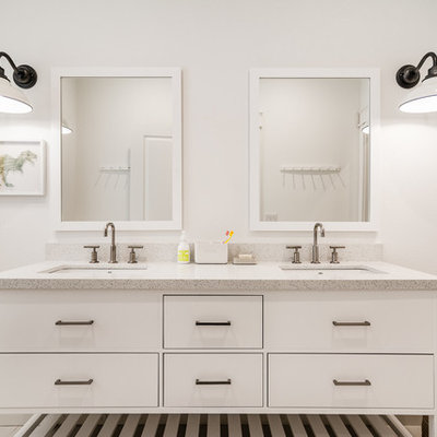 Bathroom - coastal white floor bathroom idea in Other with furniture-like cabinets, white cabinets, white walls and an undermount sink