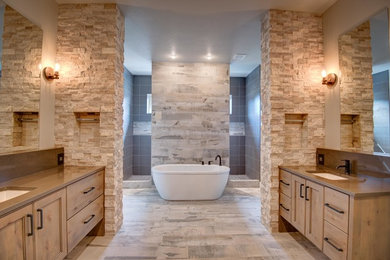 Example of a mid-sized classic master beige tile and stone tile light wood floor and beige floor bathroom design in Boise with recessed-panel cabinets, light wood cabinets, beige walls, an undermount sink and granite countertops