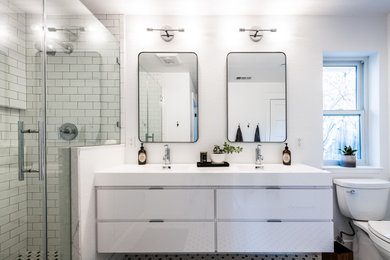 Trendy kids' white tile corner shower photo in San Francisco with white cabinets, a hinged shower door and white countertops