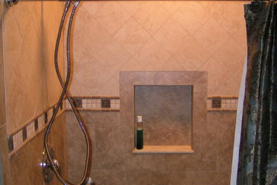 Corner shower - transitional beige tile and stone tile corner shower idea in Other with white walls