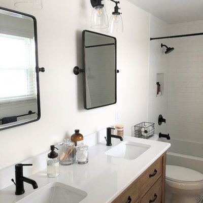 Example of a small eclectic master white tile and subway tile cement tile floor and multicolored floor bathroom design in Detroit with furniture-like cabinets, medium tone wood cabinets, a two-piece toilet, white walls, an undermount sink, quartz countertops and white countertops
