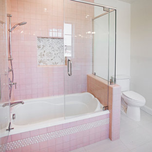 Example of a small trendy pink tile and porcelain tile ceramic tile tub/shower combo design in Los Angeles with a one-piece toilet and white walls
