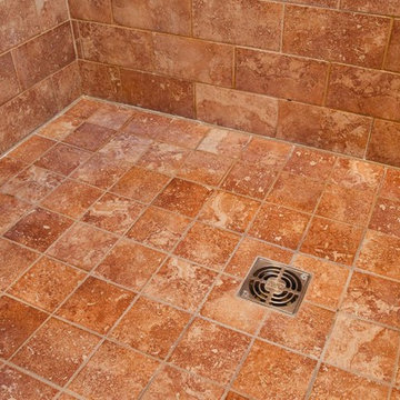 Point drain in tile shower floor