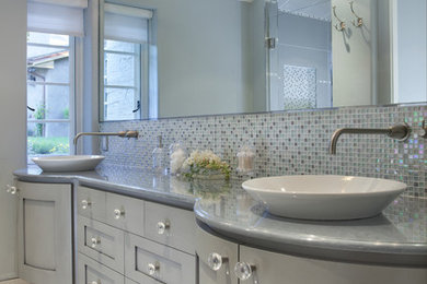 This is an example of a traditional bathroom in San Francisco with grey cabinets.