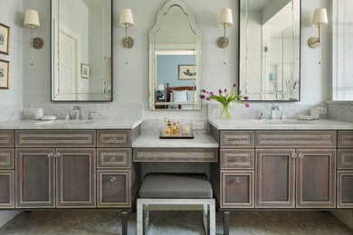 This is an example of a traditional bathroom in Denver with recessed-panel cabinets, dark wood cabinets, grey walls, a submerged sink, grey floors and white worktops.