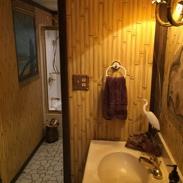 Polynesian Themed Mural thoughout a bathroom, hand-painted by Tom Taylor