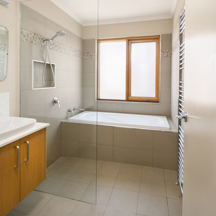 Mid-sized contemporary master wet room bathroom in Other with light wood cabinets, a drop-in tub, beige tile, engineered quartz benchtops, an open shower, white benchtops, flat-panel cabinets, cement tile, beige walls, cement tiles, a drop-in sink and beige floor.