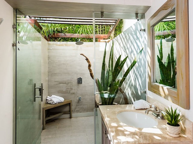 Tropical Bathroom by Costa Construction Company