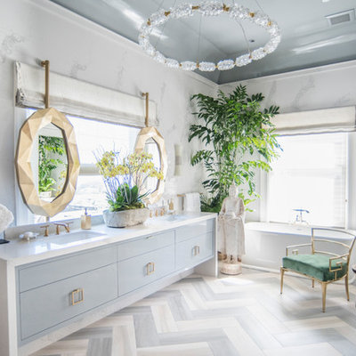 Eclectic 3/4 white tile multicolored floor freestanding bathtub photo in Seattle with flat-panel cabinets, blue cabinets, white walls and an undermount sink