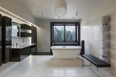 Design ideas for a large modern ensuite bathroom in Miami with flat-panel cabinets, black cabinets, a freestanding bath, beige tiles, porcelain flooring, a submerged sink, solid surface worktops, white floors and white worktops.