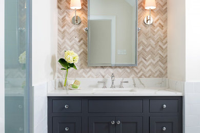 Example of a mid-sized transitional master beige tile bathroom design in DC Metro with black cabinets and white walls