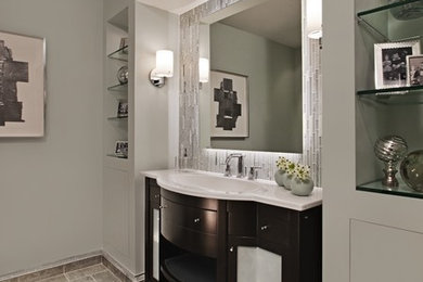Example of a mid-sized transitional gray tile and matchstick tile slate floor and gray floor bathroom design in Detroit with furniture-like cabinets, dark wood cabinets, gray walls, an undermount sink and solid surface countertops