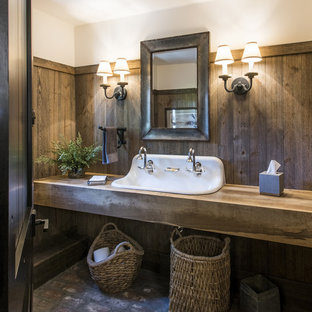 Large country bathroom in Louisville with open cabinets, medium wood cabinets, brick floors, a trough sink, wood benchtops, brown walls and brown benchtops.