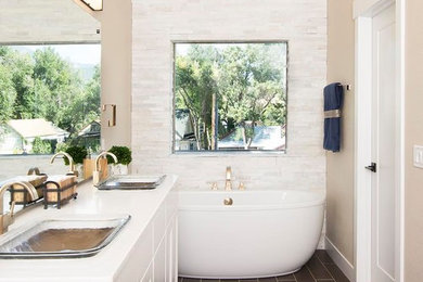 Example of a mid-sized transitional master beige tile, white tile and matchstick tile porcelain tile and black floor bathroom design in Denver with recessed-panel cabinets, white cabinets, beige walls, a drop-in sink and quartz countertops