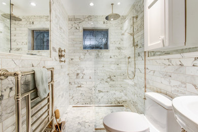 Small elegant master white tile and stone tile marble floor walk-in shower photo in Ottawa with flat-panel cabinets, white cabinets, a one-piece toilet, white walls and a pedestal sink