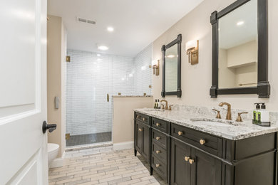 Bathroom - large traditional double-sink bathroom idea in Columbus with brown cabinets and a built-in vanity