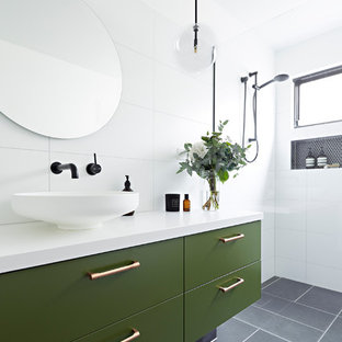 Inspiration for a mid-sized contemporary 3/4 bathroom in Melbourne with green cabinets, white tile, white walls, a vessel sink, grey floor, an open shower, white benchtops, an open shower, furniture-like cabinets, porcelain tile and engineered quartz benchtops.