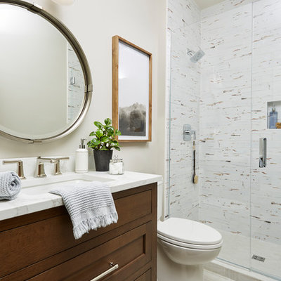 Mid-sized transitional 3/4 porcelain tile and multicolored tile porcelain tile and beige floor alcove shower photo in Minneapolis with a two-piece toilet, beige walls, an undermount sink, quartz countertops, a hinged shower door, white countertops, furniture-like cabinets and dark wood cabinets
