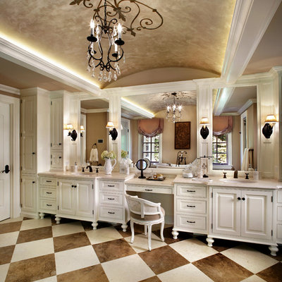 Example of a large classic limestone floor alcove shower design in New York with an undermount sink, white cabinets, beige walls, limestone countertops and raised-panel cabinets