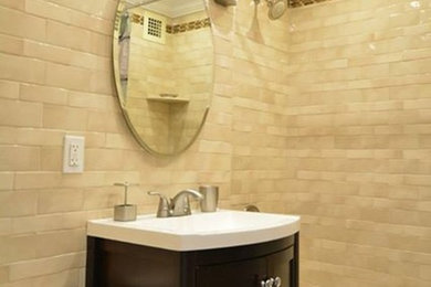 Bathroom - small traditional 3/4 beige tile and ceramic tile marble floor bathroom idea in New York with a console sink, shaker cabinets, dark wood cabinets, quartzite countertops, a one-piece toilet and beige walls