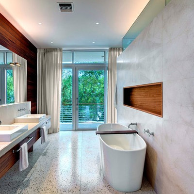 Freestanding bathtub - modern freestanding bathtub idea in Tampa with a vessel sink