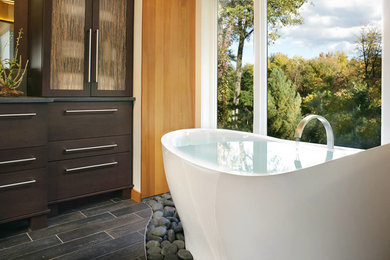 Photo of a large contemporary family bathroom in New York with a freestanding bath, a walk-in shower, brown tiles and ceramic tiles.
