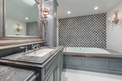 Inspiration for a small timeless master multicolored tile and marble tile ceramic tile tub/shower combo remodel in New York with a hot tub, multicolored walls, a drop-in sink and marble countertops