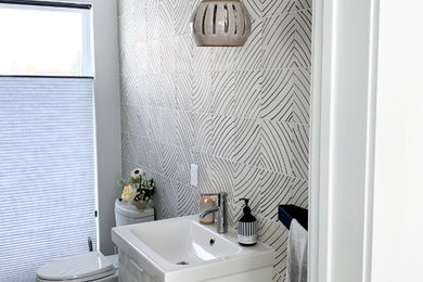 Bathroom - mid-sized black and white tile and cement tile bathroom idea in Other