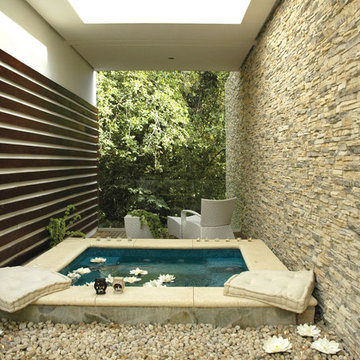 Private Spa Bath Enclosed By Stone Wall