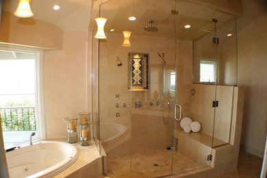 Example of a large trendy master beige tile and ceramic tile ceramic tile and beige floor bathroom design in San Francisco with flat-panel cabinets, dark wood cabinets, beige walls, an integrated sink, quartz countertops and a hinged shower door