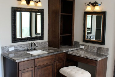 Mid-sized elegant marble floor bathroom photo in Other with shaker cabinets, dark wood cabinets, beige walls and an undermount sink
