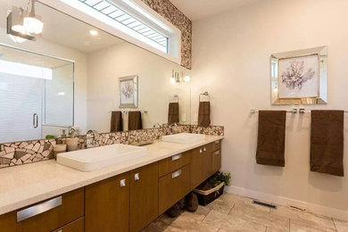 Bathroom - traditional master beige tile and stone tile porcelain tile bathroom idea in Calgary with flat-panel cabinets, medium tone wood cabinets, beige walls, a drop-in sink and quartz countertops