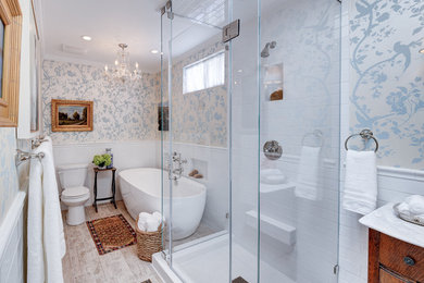 Example of a trendy master white tile light wood floor bathroom design in Los Angeles with a drop-in sink, flat-panel cabinets, medium tone wood cabinets and multicolored walls