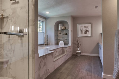 Inspiration for a large transitional master marble tile double shower remodel in Seattle with an undermount tub, gray walls and a hinged shower door
