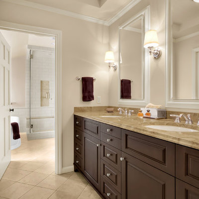 Bathroom - traditional bathroom idea in Seattle with solid surface countertops and an undermount sink