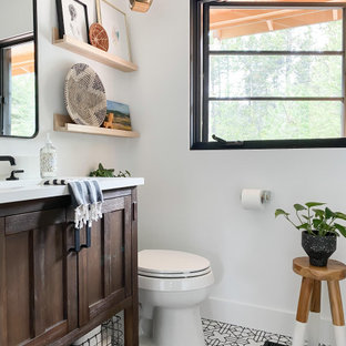 Mid-sized eclectic master white tile and ceramic tile ceramic tile, white floor and single-sink bathroom photo in Portland with dark wood cabinets, white walls, white countertops and a niche