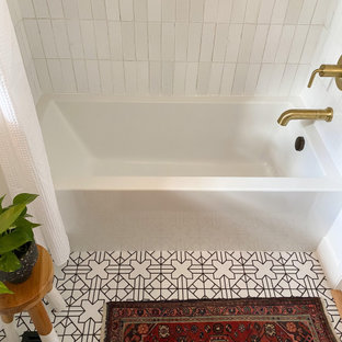This is an example of a mid-sized eclectic master bathroom in Portland with dark wood cabinets, an alcove tub, a shower/bathtub combo, white tile, ceramic tile, white walls, ceramic floors, white floor, a shower curtain, white benchtops, a niche and a single vanity.