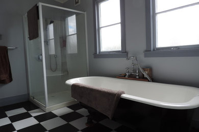 Bathroom - small eclectic master black and white tile and ceramic tile ceramic tile bathroom idea in Hamilton with blue walls