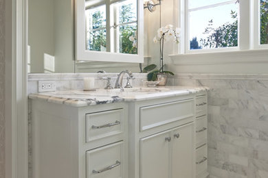 Inspiration for a timeless gray tile and subway tile bathroom remodel in Portland with an undermount sink, furniture-like cabinets, white cabinets and marble countertops