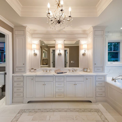 Example of a classic master white tile and marble tile toilet room design in San Francisco with an undermount sink, shaker cabinets, white cabinets, marble countertops, an undermount tub and white countertops