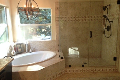 Bathroom - large traditional master beige tile and porcelain tile ceramic tile bathroom idea in Sacramento with recessed-panel cabinets, dark wood cabinets, granite countertops, a one-piece toilet, an undermount sink and beige walls