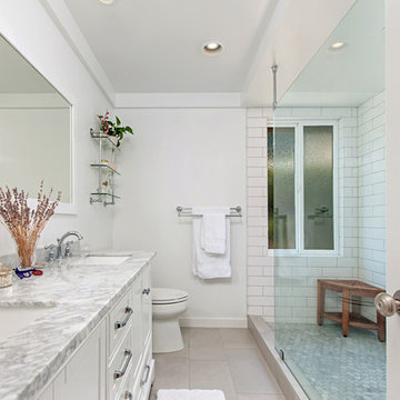Modern White Master Bathroom Remodel by Classic Home Improvements